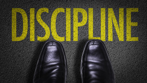 Top View of Business Shoes on the floor with the text: Discipline